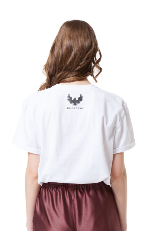 White crew neck T-shirt with rolled sleeves and a logo at the back. by DIANA ARNO